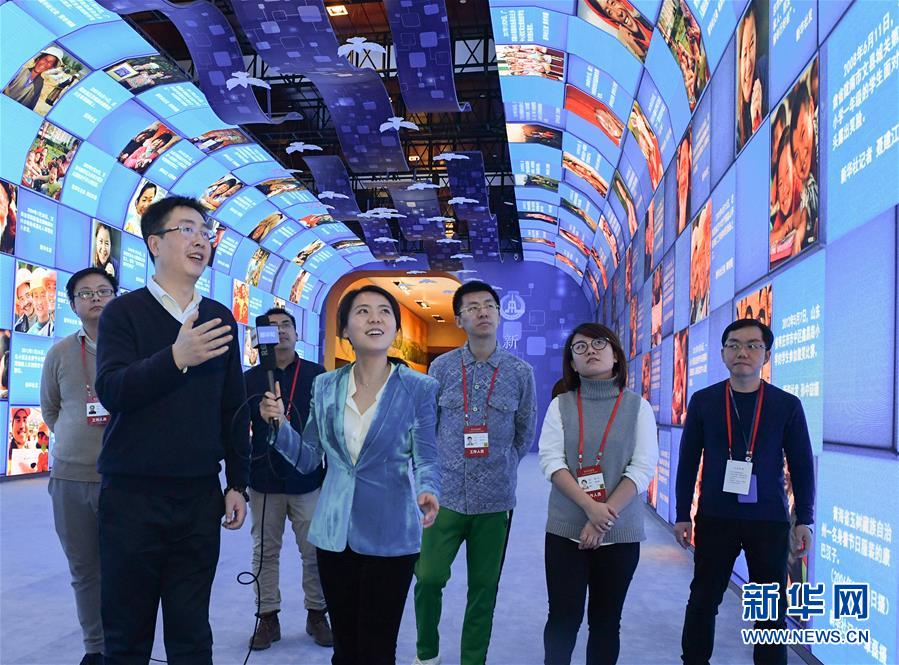 (圖文互動)(3)筆墨書崢嶸 光影繪壯美——慶祝改革開放40周年大型展覽新華社展項掃描